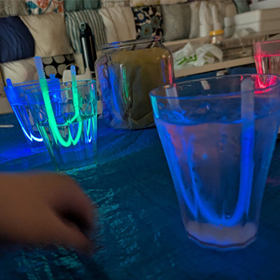Glowing laps in a dark room