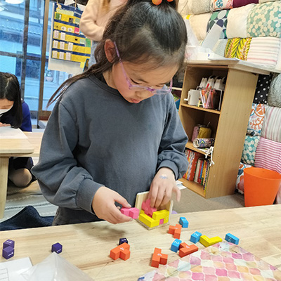 Girl solving a puzzle